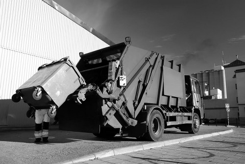 crew removing garden waste and loading a van